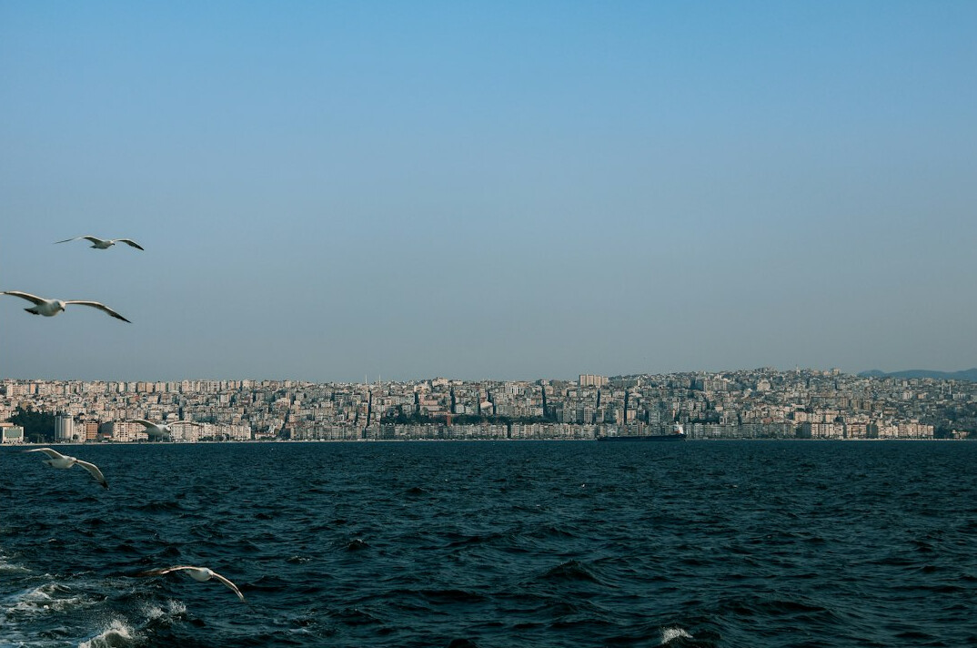 Izmir gulf at night with city lights reflecting on the water