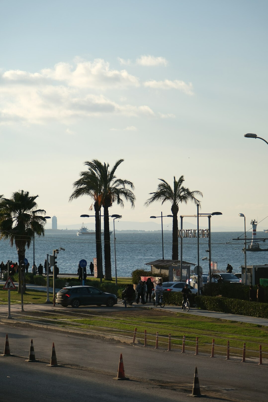 Seaside promenade Kordon in Izmir with palm trees and the bay