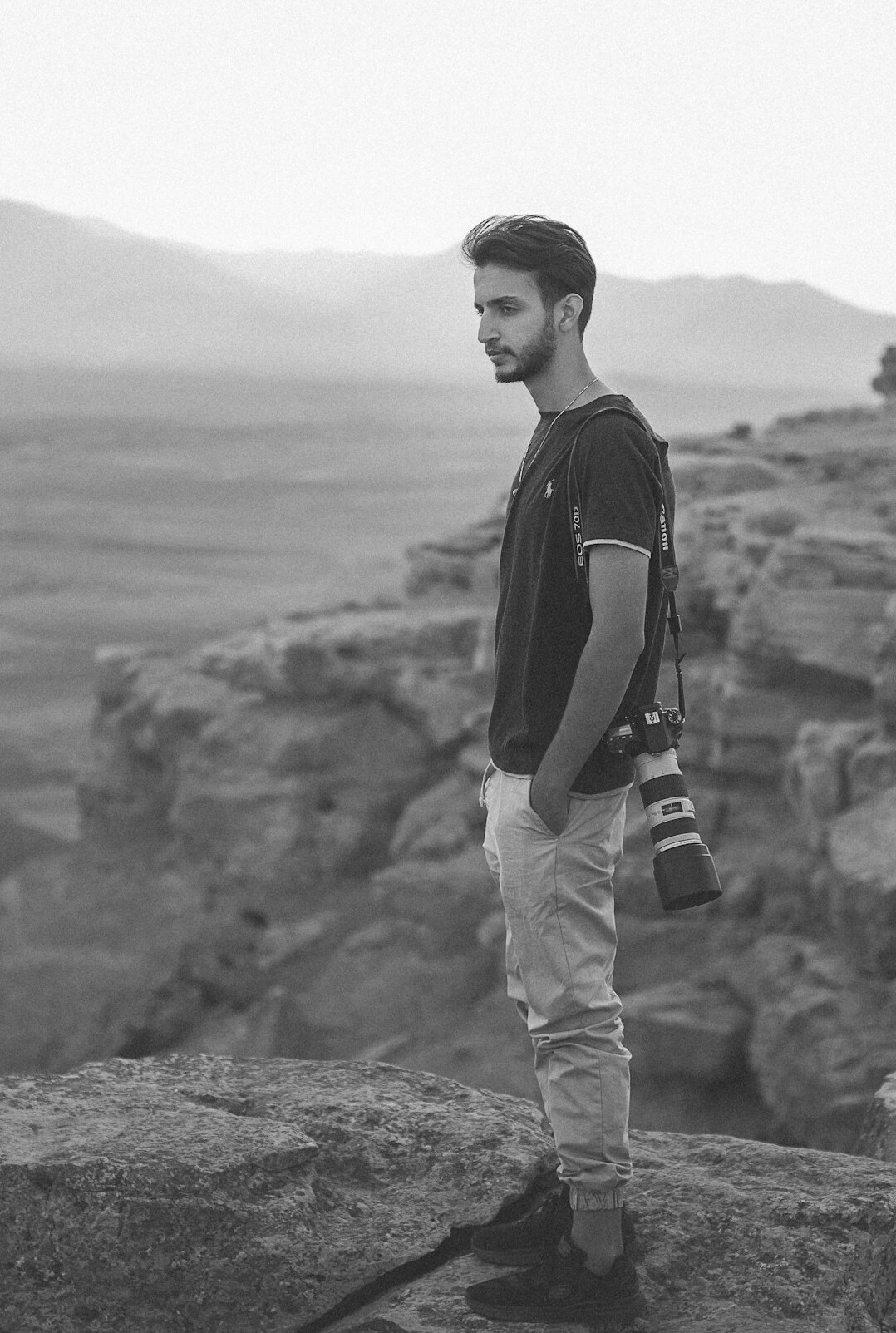 Portrait of a Turkish man field reporter with a camera strap